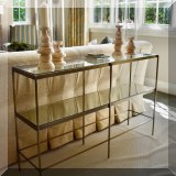 F09. Metal and glass tiered console table. 30”w x 48”w x 11”d 